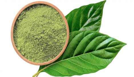 image of kratom powder and leaves